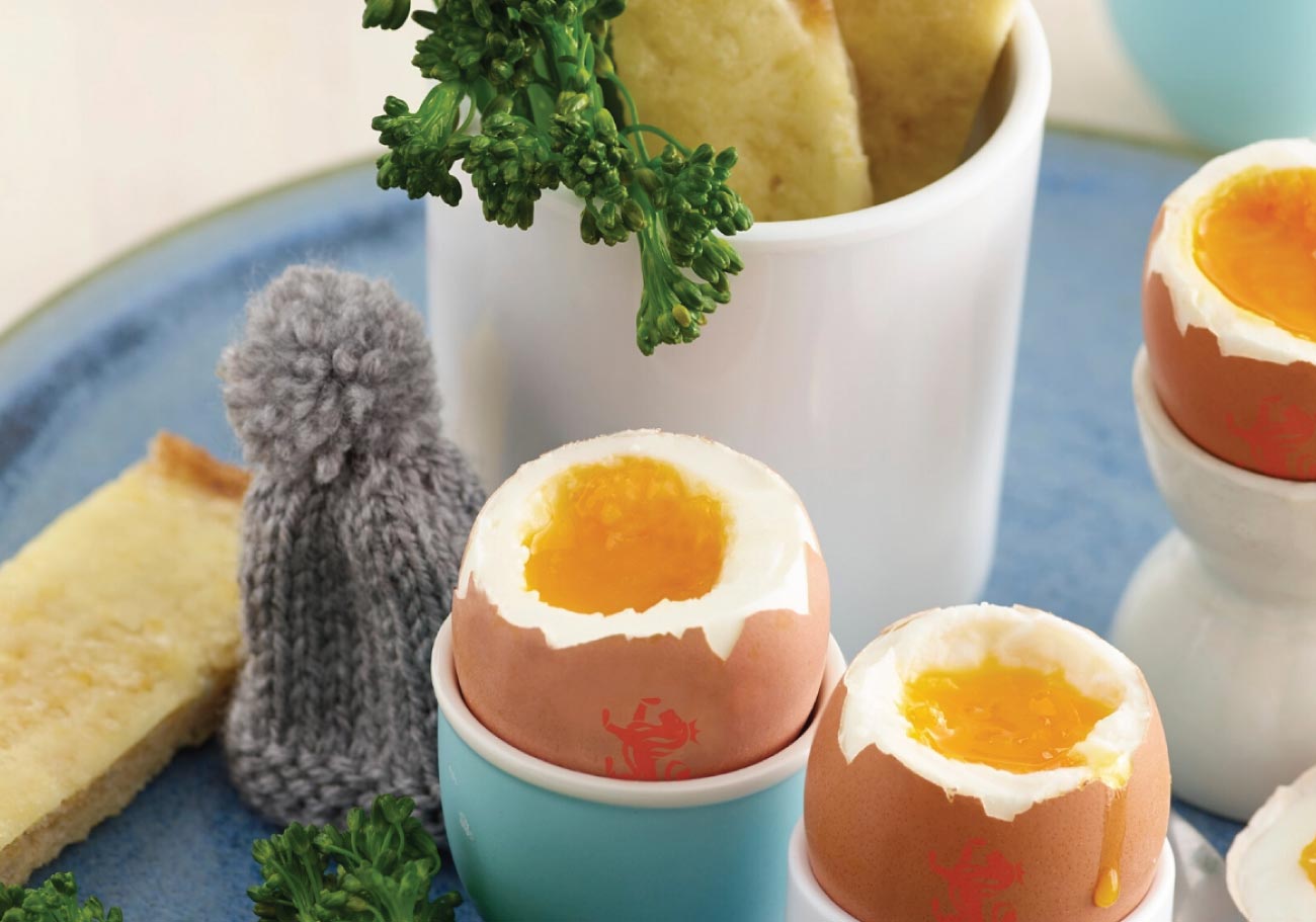 Boiled egg with broccoli and cheese soldiers